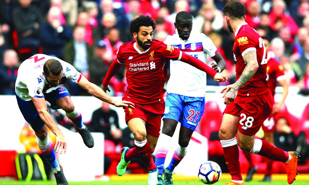 Liverpool’s Mo Salah goes past Erik Pieters.