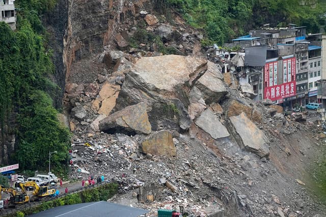 Rescuers race to find survivors in rain after landslide in China kills at least 8