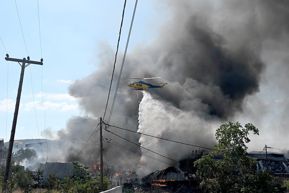 Wildfires rage in Portugal, Greece and Spain while Greek authorities warn of toxic smoke